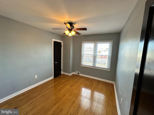 unfurnished room with ceiling fan and light hardwood / wood-style floors