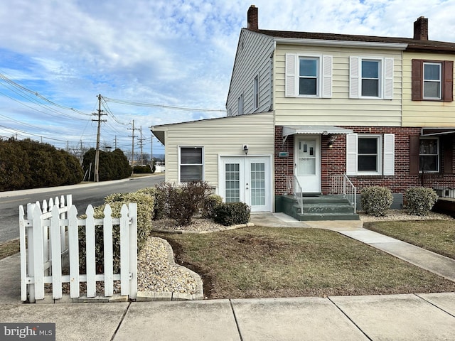 view of front facade featuring french doors