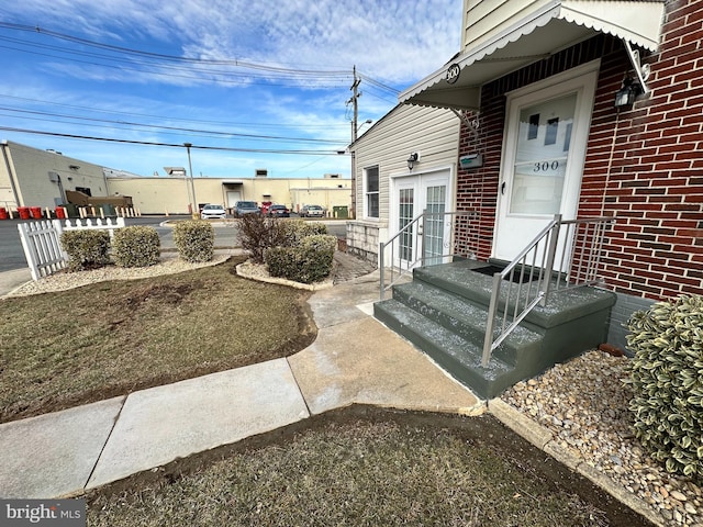 entrance to property featuring french doors