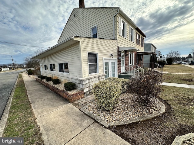 view of home's exterior with a lawn