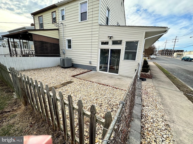 back of property featuring a patio and central AC unit