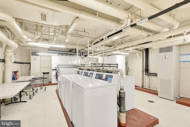 shared laundry area featuring visible vents and washer and dryer