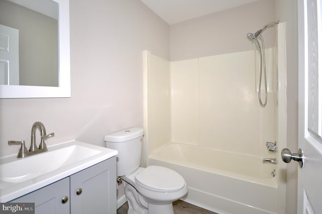 full bathroom featuring vanity, shower / washtub combination, and toilet