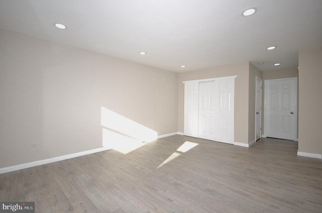 empty room featuring hardwood / wood-style flooring