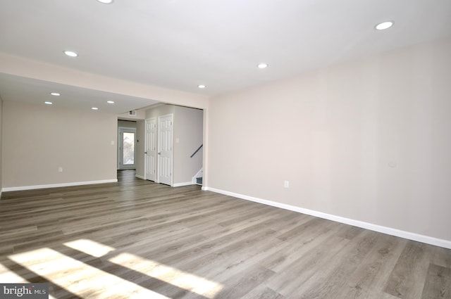 unfurnished room with light wood-type flooring