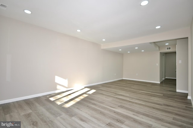 empty room with hardwood / wood-style floors