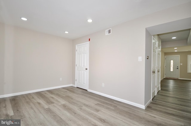 unfurnished room featuring light hardwood / wood-style flooring