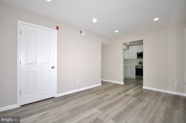 empty room with light wood-type flooring