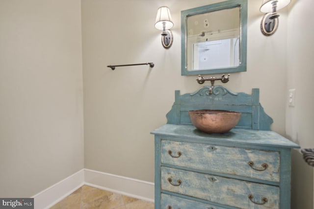 bathroom with vanity and baseboards