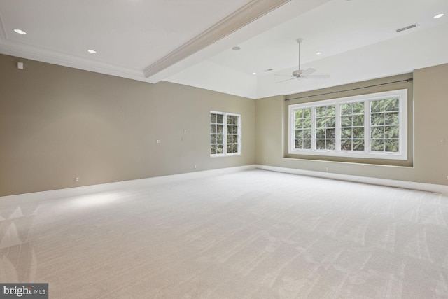 carpeted empty room with recessed lighting, a ceiling fan, visible vents, baseboards, and ornamental molding