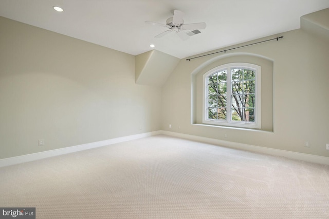 additional living space featuring recessed lighting, baseboards, ceiling fan, and light colored carpet