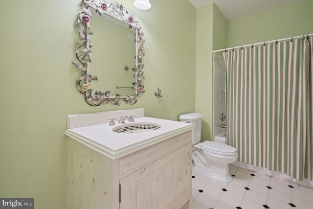 bathroom featuring toilet, tile patterned flooring, shower / bath combination with curtain, and vanity