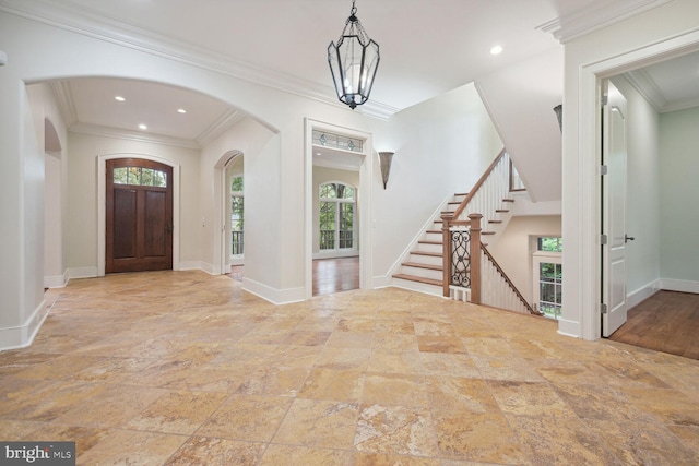 foyer with ornamental molding, stairway, recessed lighting, and baseboards