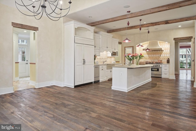 kitchen featuring premium range hood, white cabinets, dark wood-type flooring, and built in appliances