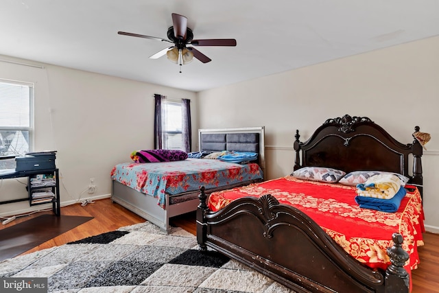 bedroom featuring ceiling fan and light wood-type flooring