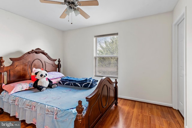 bedroom with hardwood / wood-style flooring and ceiling fan