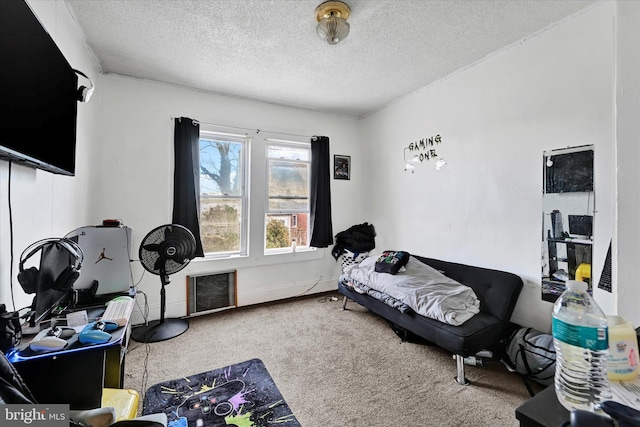 carpeted bedroom with a textured ceiling