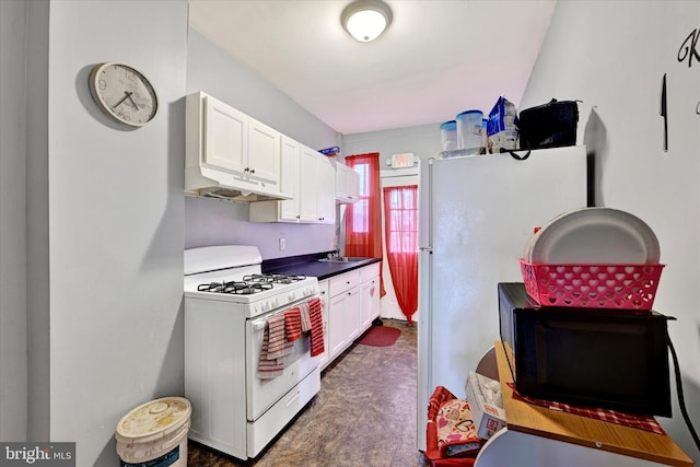 kitchen featuring white cabinetry, sink, and white appliances