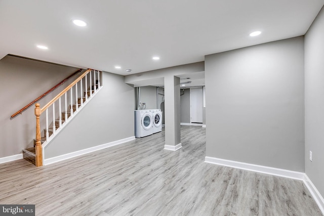 interior space featuring washer and clothes dryer and light wood-type flooring