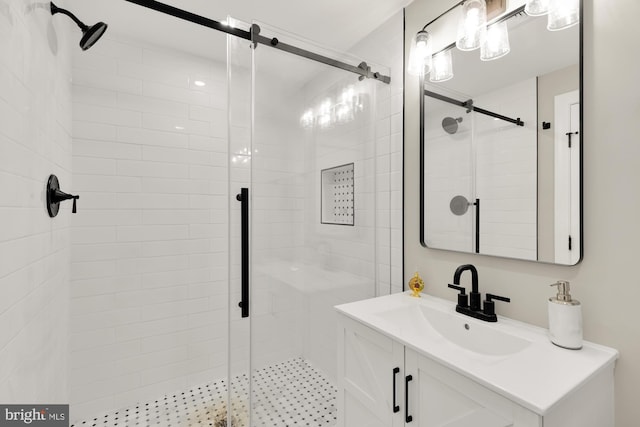 full bath featuring a shower stall and vanity