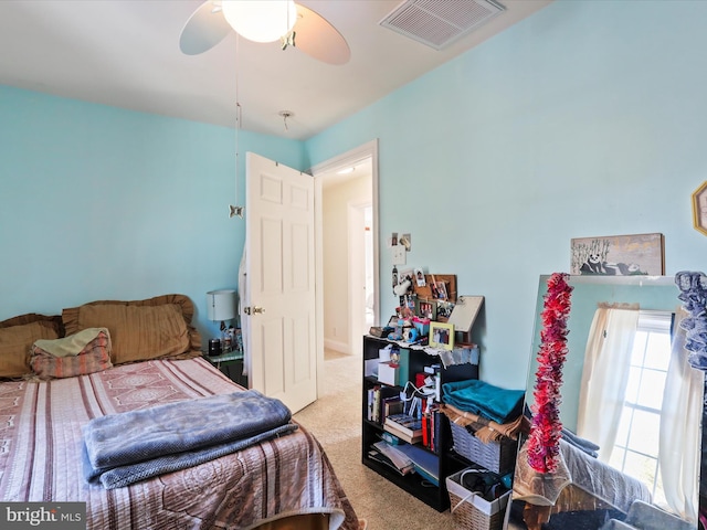 carpeted bedroom with ceiling fan