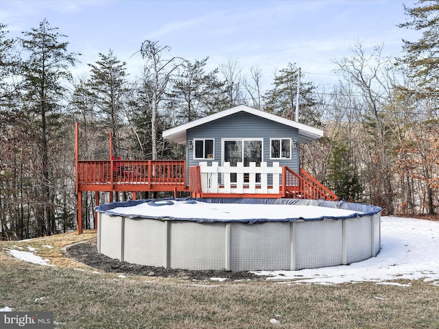 view of swimming pool featuring a deck