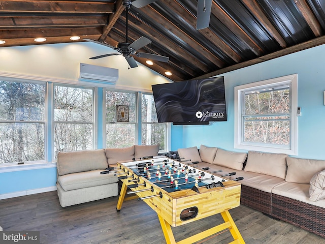 playroom with hardwood / wood-style floors, plenty of natural light, and a wall mounted air conditioner