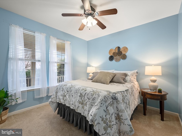 bedroom featuring ceiling fan and light carpet