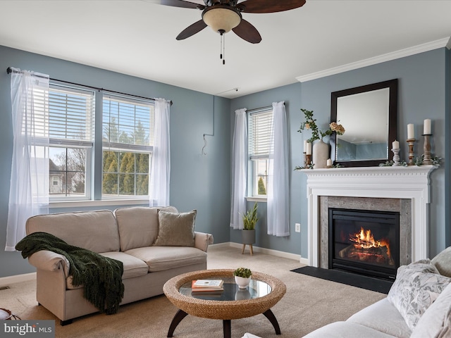 living room featuring crown molding, ceiling fan, and carpet flooring