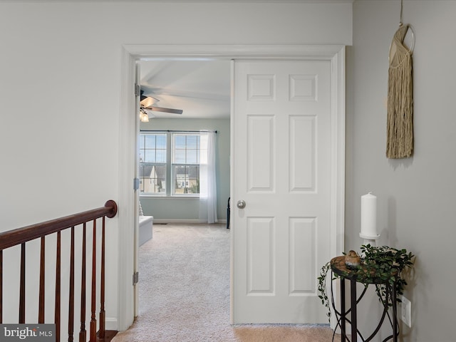 corridor with light carpet