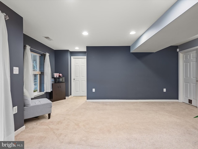 living area with light colored carpet