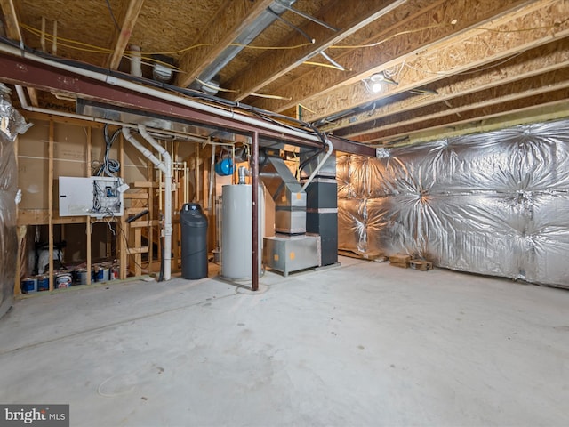 basement featuring water heater and heating unit