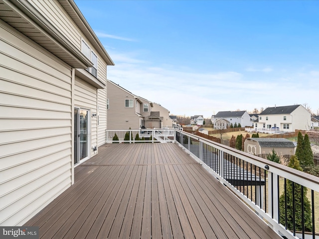 wooden deck with a shed