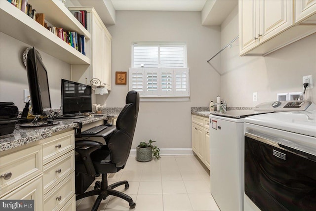 office area with light tile patterned floors, separate washer and dryer, a sink, baseboards, and built in study area