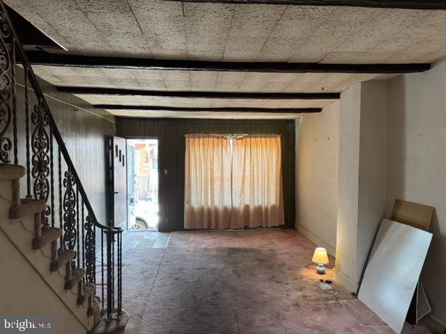 foyer with beamed ceiling