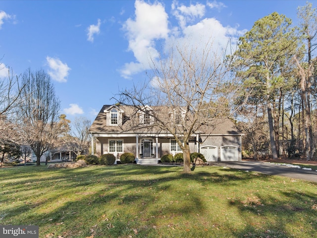 cape cod home with a garage and a front lawn