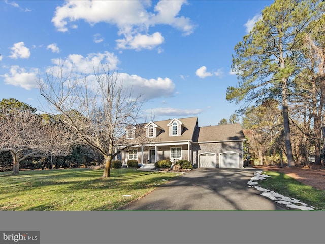 new england style home with a garage and a front lawn