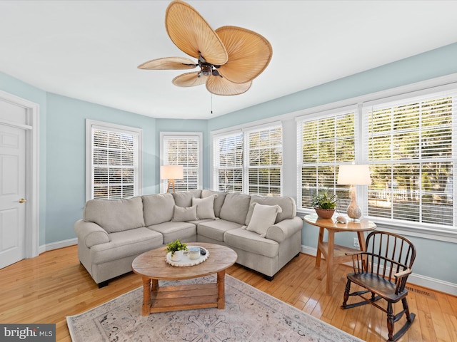 sunroom / solarium with ceiling fan