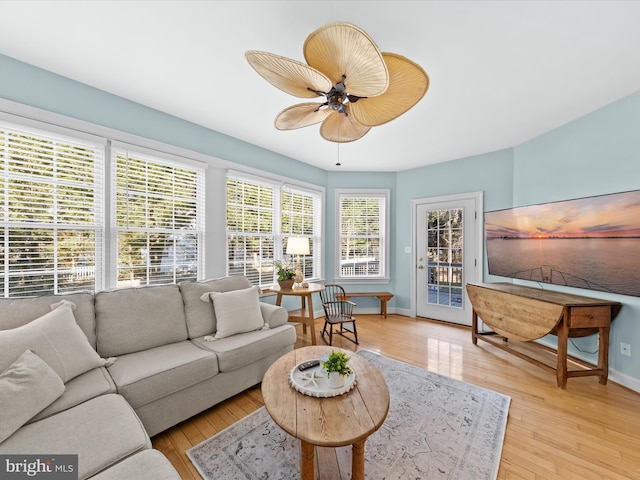 sunroom featuring ceiling fan