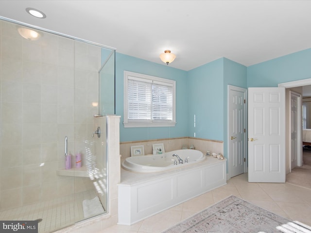 bathroom featuring plus walk in shower and tile patterned floors