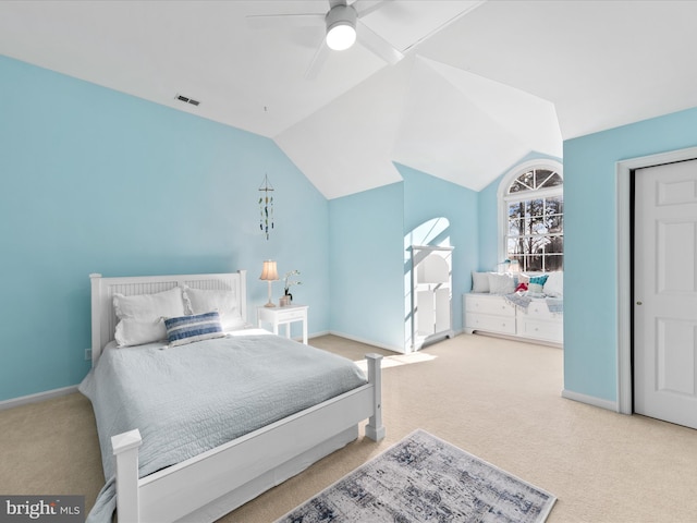 bedroom with vaulted ceiling, carpet flooring, and ceiling fan