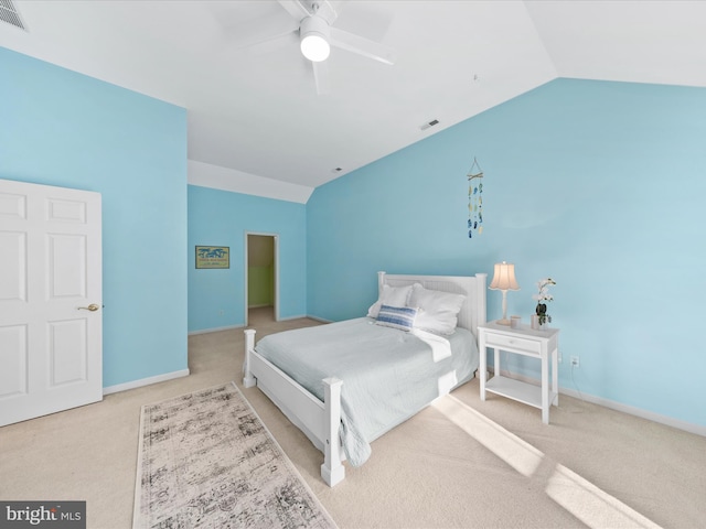 bedroom featuring ceiling fan, vaulted ceiling, and carpet