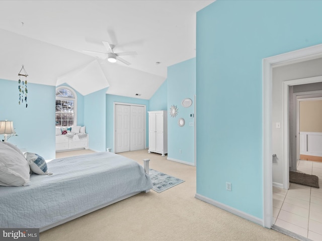 bedroom featuring ceiling fan, carpet flooring, and vaulted ceiling