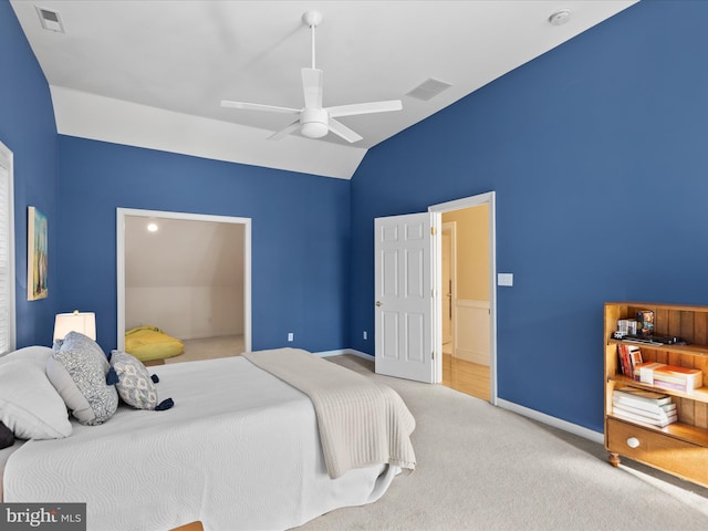 carpeted bedroom with lofted ceiling and ceiling fan