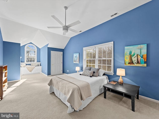 carpeted bedroom featuring vaulted ceiling, ceiling fan, and a closet