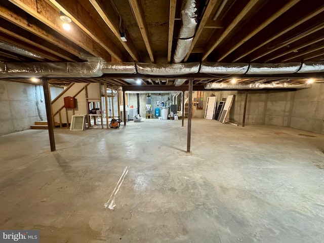 unfinished below grade area with gas water heater and stairway