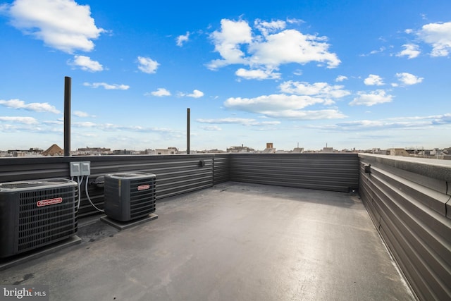 view of patio / terrace with a balcony and central AC unit