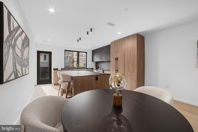 dining area with light hardwood / wood-style flooring