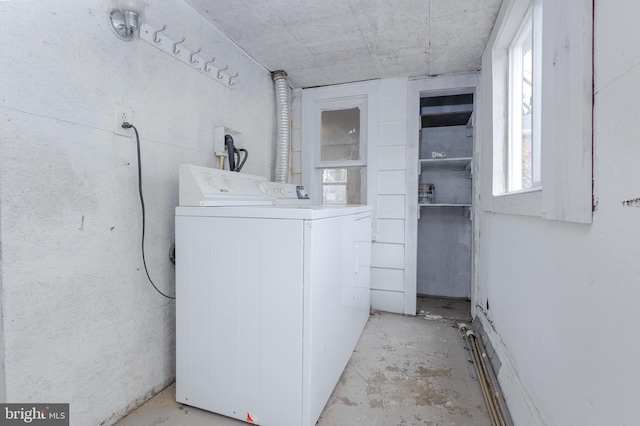 washroom with washer / dryer