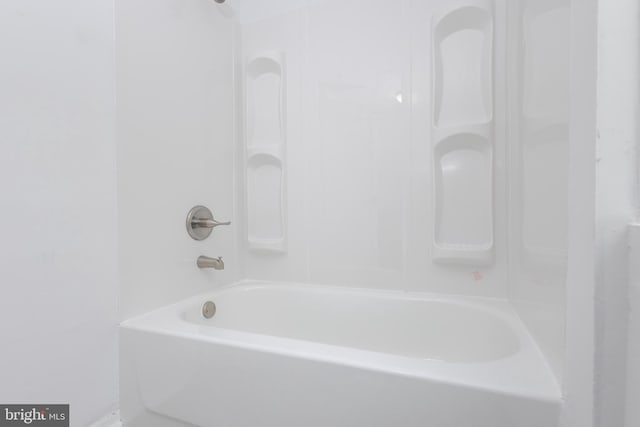 bathroom with bathing tub / shower combination